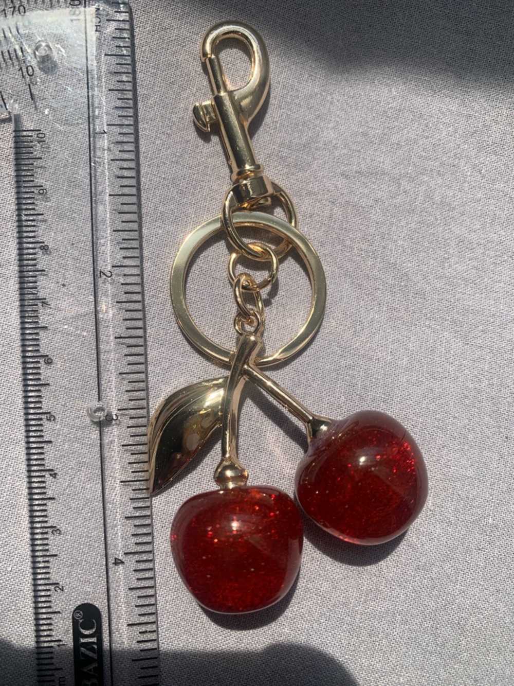 🆕- MINI SPARKLING CHEERY’S  BAG OR KEYRING CHARM GOLD HARDWARE